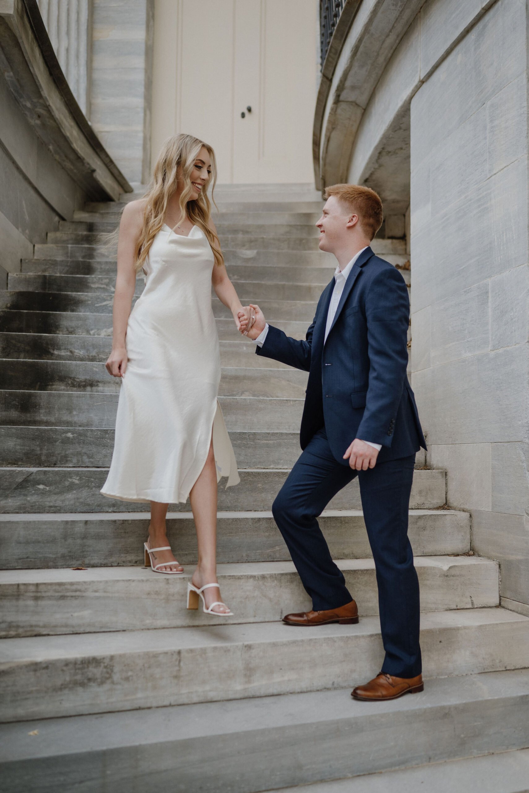 Engagement Photos in Philadelphia of couple walking down stairs