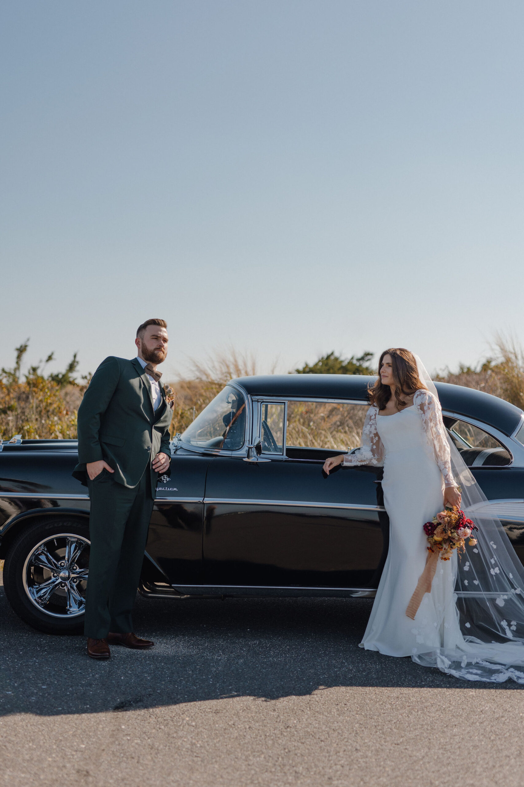 bride and groom with vintage classic car